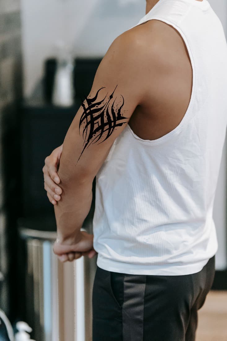 Tattoo design composited onto an upper arm